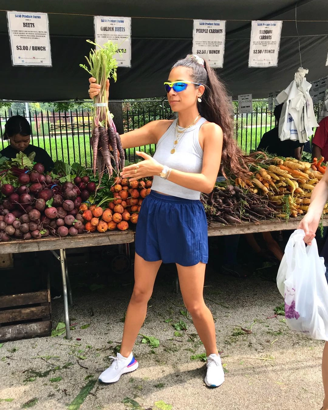 Bianca Valle at a farmers market stand